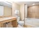 Bathroom featuring a granite countertop sink, toilet, and combined bathtub and shower at 201 S Ocean Blvd. # 1112, Myrtle Beach, SC 29577