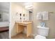 Bathroom featuring a granite countertop sink, toilet, and white doors at 201 S Ocean Blvd. # 1112, Myrtle Beach, SC 29577