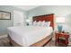 Bedroom featuring a queen bed with side tables and lamps at 201 S Ocean Blvd. # 1112, Myrtle Beach, SC 29577