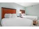 Bedroom showcasing two beds, side table with lamp and phone at 201 S Ocean Blvd. # 1112, Myrtle Beach, SC 29577