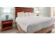 Bedroom featuring a queen bed with side tables and lamps at 201 S Ocean Blvd. # 1112, Myrtle Beach, SC 29577