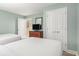 Bedroom showcasing two beds, tv with dresser, and double closets at 201 S Ocean Blvd. # 1112, Myrtle Beach, SC 29577