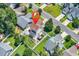 Aerial view of property showcasing landscaped backyard with hot tub, fire pit, sunroom, and manicured lawns at 2017 Chadbury Ln., Myrtle Beach, SC 29588