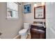 Bathroom featuring a granite countertop vanity, toilet and decorative mirror at 2017 Chadbury Ln., Myrtle Beach, SC 29588