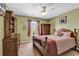 Charming bedroom with a wood bed, dresser, and ample natural light from the window at 2017 Chadbury Ln., Myrtle Beach, SC 29588