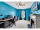Blue bedroom with a ceiling fan, a dark desk and a fireplace at 2017 Chadbury Ln., Myrtle Beach, SC 29588