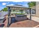Backyard gazebo with hot tub, providing a serene and luxurious outdoor experience at 2017 Chadbury Ln., Myrtle Beach, SC 29588
