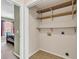 Laundry room with tile floor and built-in shelving, conveniently located near the bedrooms at 2017 Chadbury Ln., Myrtle Beach, SC 29588