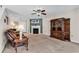 Comfortable living room with a fireplace, TV, sofa, and cabinet, perfect for Gathering gatherings at 2017 Chadbury Ln., Myrtle Beach, SC 29588