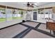 Bright sunroom featuring expansive windows, a ceiling fan, and stylish decor, perfect for relaxation at 2017 Chadbury Ln., Myrtle Beach, SC 29588