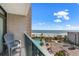 Balcony with chairs overlooking ocean, pool, parking, and beach access at 202 74Th Ave. N # 2547/2548, Myrtle Beach, SC 29572