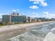 Beach with view of the ocean and hotels, perfect for vacationers at 202 74Th Ave. N # 2547/2548, Myrtle Beach, SC 29572