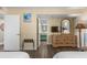 Bedroom with view into en-suite bath, tv, and plenty of drawer space for your vacation items at 202 74Th Ave. N # 2547/2548, Myrtle Beach, SC 29572