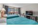 Relaxing bedroom offers two beds, a TV, and balcony access with views at 202 74Th Ave. N # 2547/2548, Myrtle Beach, SC 29572