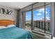 Bright bedroom featuring balcony access, coastal view, and comfortable bed at 202 74Th Ave. N # 2547/2548, Myrtle Beach, SC 29572