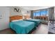 Comfortable bedroom featuring two beds, a view, and neutral decor at 202 74Th Ave. N # 2547/2548, Myrtle Beach, SC 29572