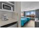 Inviting bedroom features two cozy beds, a kitchenette, and a large window at 202 74Th Ave. N # 2547/2548, Myrtle Beach, SC 29572