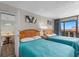 Charming bedroom with two beds, and access to dining area and balcony at 202 74Th Ave. N # 2547/2548, Myrtle Beach, SC 29572
