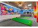 Indoor game room with miniature golf, a bench, and underwater themed wall art at 202 74Th Ave. N # 2547/2548, Myrtle Beach, SC 29572