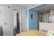 Bright living area with coastal decor, leading to bedroom and kitchen at 202 74Th Ave. N # 2547/2548, Myrtle Beach, SC 29572