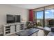 Cozy living room opens to balcony offering a view of the beach, creating a seamless indoor-outdoor experience at 202 74Th Ave. N # 2547/2548, Myrtle Beach, SC 29572