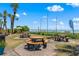 Outdoor picnic area with multiple tables, set on brick pavers with a view of the beach and ocean at 202 74Th Ave. N # 2547/2548, Myrtle Beach, SC 29572