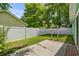 Backyard featuring a privacy fence surrounding a grassy yard and a concrete patio area at 202 Millstone Dr., Myrtle Beach, SC 29588