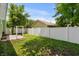Backyard featuring a privacy fence surrounding a grassy yard with trees at 202 Millstone Dr., Myrtle Beach, SC 29588