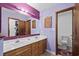 Bathroom features a double sink vanity and toilet, with lavender walls for a calming ambiance at 202 Millstone Dr., Myrtle Beach, SC 29588