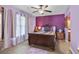 Bedroom with purple walls, a ceiling fan, and a beautifully made wooden bed frame at 202 Millstone Dr., Myrtle Beach, SC 29588