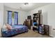 Neutral bedroom with plenty of light and a dark wood dresser with storage space at 202 Millstone Dr., Myrtle Beach, SC 29588