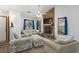 Bright living room with a stone fireplace, neutral furniture, and an open layout for entertaining at 202 Millstone Dr., Myrtle Beach, SC 29588