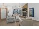 Spacious living room featuring a stone fireplace, comfortable seating, and bright, natural light at 202 Millstone Dr., Myrtle Beach, SC 29588