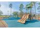Vibrant community playground featuring a slide and multiple play structures on a cushioned safety surface at 202 Millstone Dr., Myrtle Beach, SC 29588