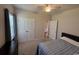 Relaxing bedroom with carpeted floors, a ceiling fan, and a view of the outdoors at 206 N Levee Dr., Georgetown, SC 29440