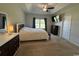 Spacious carpeted main bedroom with a ceiling fan, TV, and ample natural light at 206 N Levee Dr., Georgetown, SC 29440