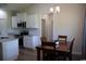 Cozy dining area adjacent to a modern kitchen with stainless steel appliances and ample counter space at 206 N Levee Dr., Georgetown, SC 29440