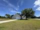 A charming single-story home with a manicured lawn, long driveway, and attached garage at 206 N Levee Dr., Georgetown, SC 29440