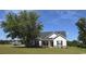 Charming single story home with light siding, manicured lawn and mature shade tree at 206 N Levee Dr., Georgetown, SC 29440
