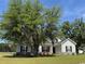Charming single story home with light siding, manicured lawn and mature shade tree at 206 N Levee Dr., Georgetown, SC 29440