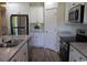 Well-lit kitchen showcasing granite countertops, stainless steel appliances, and white cabinetry at 206 N Levee Dr., Georgetown, SC 29440