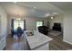 Open-concept living space featuring a kitchen island, dining area, and comfortable seating arrangement at 206 N Levee Dr., Georgetown, SC 29440