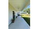 Relax on the covered porch and enjoy the tranquil views of the lush backyard at 206 N Levee Dr., Georgetown, SC 29440