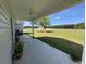 Enjoy the fresh air on the covered porch, perfect for relaxing and entertaining outdoors at 206 N Levee Dr., Georgetown, SC 29440