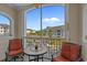 Balcony with seating area offers a view of the community buildings, landscaping, and a clear sky at 2241 Waterview Dr. # 537, North Myrtle Beach, SC 29582