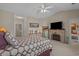 A spacious bedroom featuring a cozy fireplace, television, and access to an ensuite bathroom at 2241 Waterview Dr. # 537, North Myrtle Beach, SC 29582