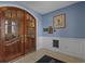 Inviting foyer with classic wood doors, wainscoting, and a stylish decorative touches at 2241 Waterview Dr. # 537, North Myrtle Beach, SC 29582