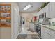 View of the bright kitchen featuring stainless steel appliances and white cabinetry, flowing into other living areas at 2241 Waterview Dr. # 537, North Myrtle Beach, SC 29582