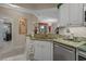 Kitchen sink area features granite countertops, stainless steel appliances, white cabinetry, and a view to the dining and living room at 2241 Waterview Dr. # 537, North Myrtle Beach, SC 29582
