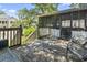 Rustic back porch featuring weathered wood and comfortable seating, perfect for relaxation at 2425 Park St., North Myrtle Beach, SC 29582